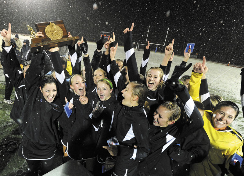 NUMBER 1: The Skowhegan field hockey team celebrates its Class A Championship win over Marshwood Saturday at Yarmouth.