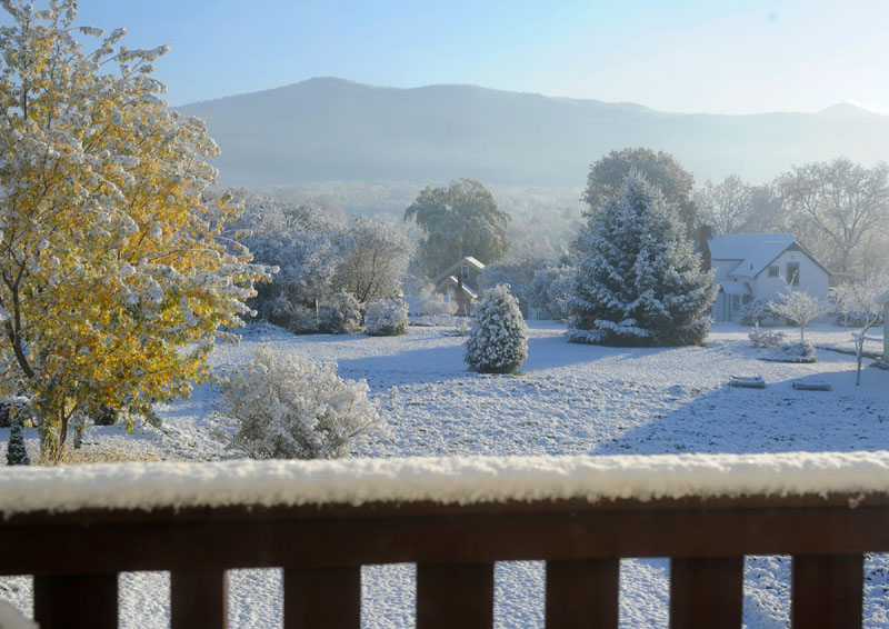 LOOKING LIKE WINTER: Rutland, Vt., residents woke up to this view to the east on Friday morning as a storm left a cover of snow. There were up to 6 inches of snow atop Killington. More snow and rain is predicted across New England tonight.