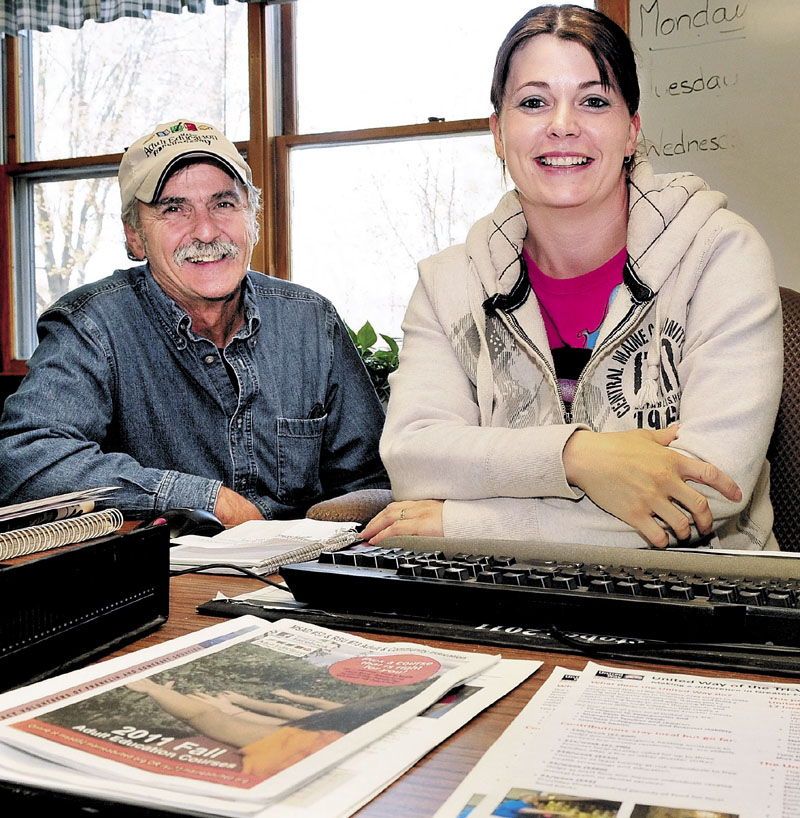 BACK TO SCHOOL: Jean Mason sits at a desk at the Franklin County Adult Education Center in Farmington. Beside her is Ray Therrien, who helped inspire Mason to seek new training with the Franklin County Community College Network.