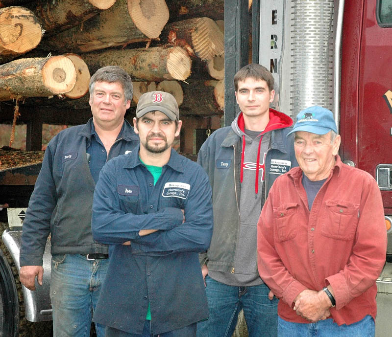 FAMILY AFFAIR: From left, Tracy Morrison, his sons, Ross Morrison and Kyle Morrison, and his father John Morrison stand for a photo. The family will mark 30 years in the forestry business in Harmony this fall.