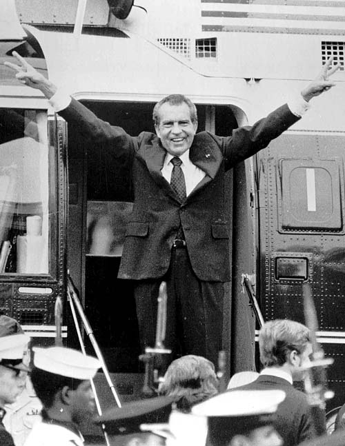 Richard Nixon says goodbye to members of his staff outside the White House on Aug. 9, 1974, as he boards a helicopter after resigning the presidency.