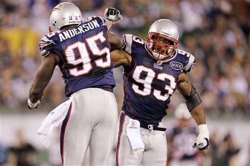 New England Patriots' Andre Carter (93) and Mark Anderson (95) celebrate during the Patriots win over the Jets, recently. Carter has 8 1/2 sacks for the Patriots.