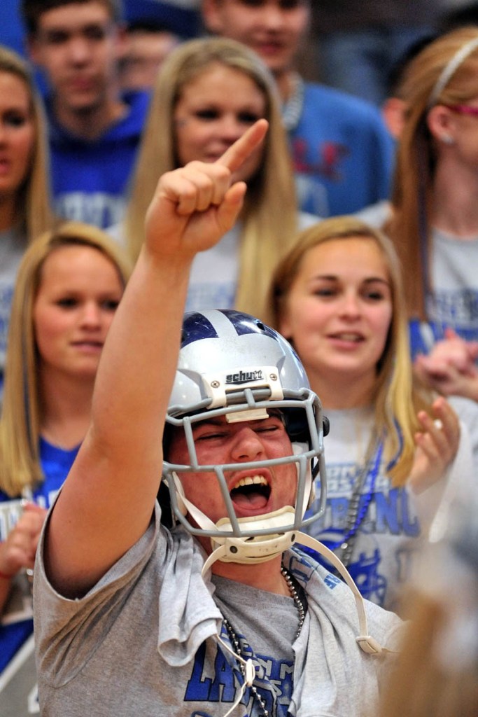 Staff photo by Michael G. Seamans Lawrence High School junior, Zach Cayer, cheers during a pep rally for the Lawrence football team at Lawrence High School in Fairfield Friday. Lawrence will play Cheverus tomorrow in Portland for the Class A state championship at 11am.