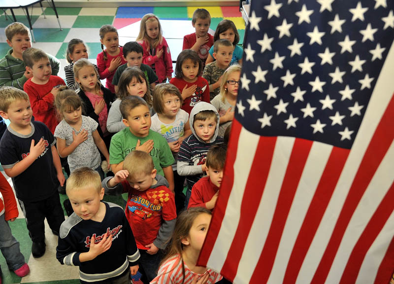 Kindergartners gather at James H. Bean Elementary School in Sidney. A new state law says schools must provide students with the opportunity to recite the Pledge of Allegiance.