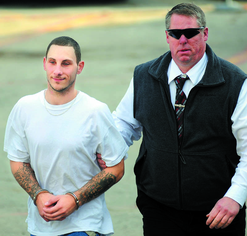 APPREHENDED: Ronald Willey, 28, left, is escorted to jail by Kennebec County Sheriff’s Department Detective David Bucknam after his arrest on charges of aggravated assault Thursday in Augusta. Willey allegedly attacked his girlfriend Sunday in Rome.
