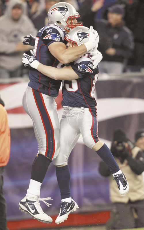 TIME TO CELEBRATE: New England Patriots tight end Rob Gronkowski, left, is congratulated by Wes Welker (83) after his touchdown against the Kansas City Chiefs during the second quarter Monday night in Foxborough, Mass.