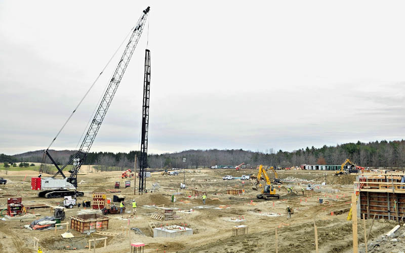A pile driver, right and concrete forms, left, are some of the many things on the site on Monday afternoon as construction work continues at the site of the new MaineGeneral hospital in Augusta.