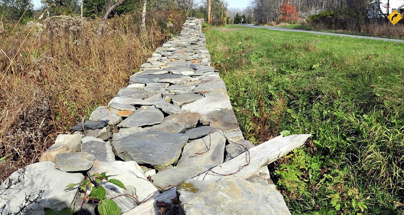 This rock wall on Kirk Olson’s property along Brighton Road in Solon must be removed by Nov. 9 or the town will because the wall is too close to the roadway.