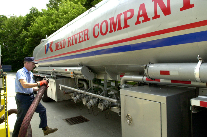A Dead River Company employee unloads heating fuel at the Dead River terminal in Auburn.