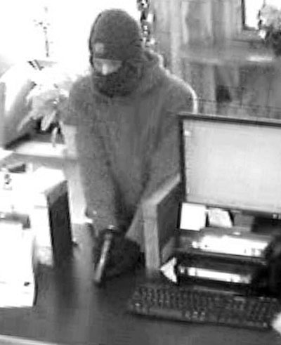 SUSPECT: A man who robbed Border Trust on Route 3 in South China on Friday is seen from the bank’s surveillance camera.