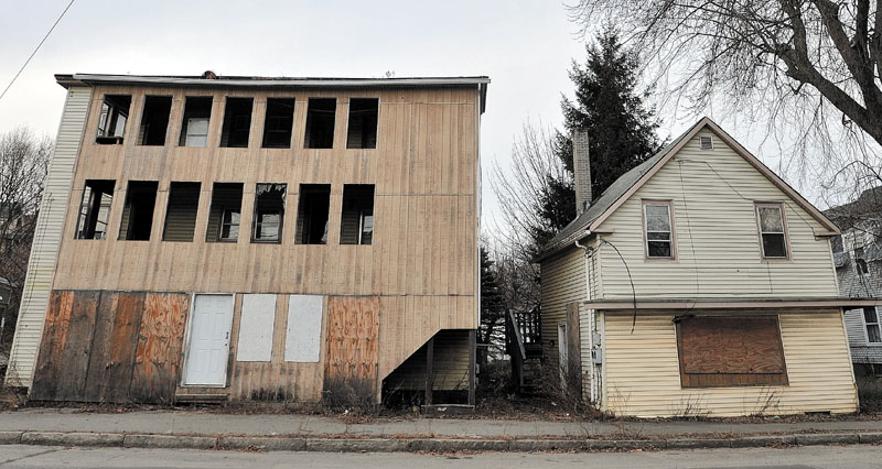 GOING DOWN: Two buildings on Water Street in Waterville are set to be demolished on Monday morning.
