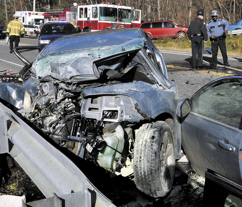 FATAL WRECK: Rescue workers used extrication tools to remove Dawn Poplawski from this car after it collided with an SUV on U.S. Route 2 near the Great Eddy of the Kennebec River in Skowhegan on Thursday. Poplawski, 59, of Canaan, died in the crash.