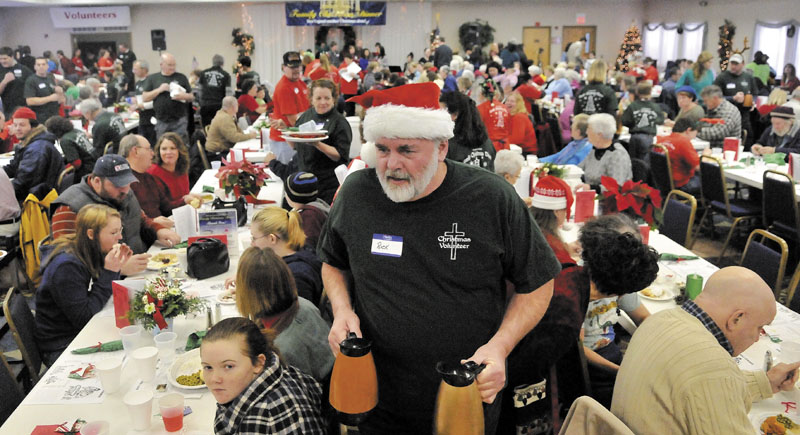 DINERS CLUB: Rick Fischer, a volunteer from South China, looks for empty coffee cups that need filling at the fifth annual Central Maine Family Christmas Dinner at the Elks Lodge in Waterville on Sunday.