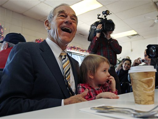 Republican presidential candidate Rep. Ron Paul, R-Texas, laughs as he sits down with Elizabeth Rose Chamberlain, 3, of Epping, N.H., while campaigning at the Early Bird Cafe in Plaistow, N.H., Tuesday Dec. 20, 2011. (AP Photo/Charles Krupa) Republican presidential candidate Rep. Ron Paul, R-Texas, laughs as he sits down with Elizabeth Rose Chamberlain, 3, of Epping, N.H., while campaigning at the Early Bird Cafe in Plaistow, N.H., Tuesday Dec. 20, 2011. (AP Photo/Charles Krupa)