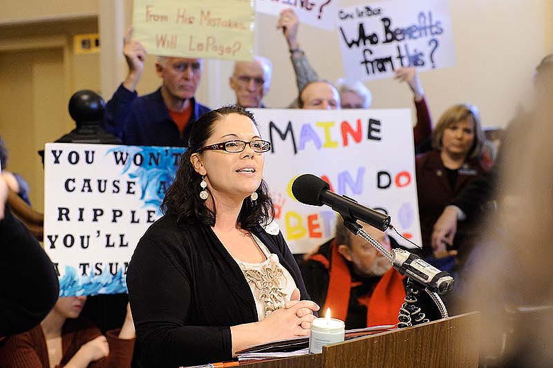John Patriquin/Staff Photographer. Wed., Dec.14, 2011. Lewiston parent Shanna Rogers speaks during s rally in the Hall of Flags at the State House in Augusta against cuts in health care. Hundreds of Mainers are protesting and testifying against the cuts