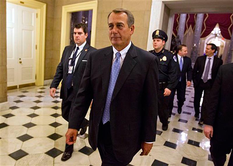 House Speaker John Boehner of Ohio walks of the floor of the House chamber on Tuesday, Dec. 20, 2011, in Washington. (AP Photo/Evan Vucci)