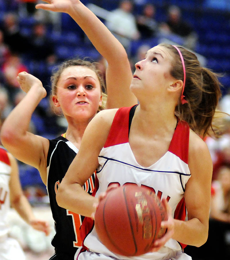 TIGHT DEFENSE: Cony High School’s Josie Lee, right, looks for an opening while being guarded by Gardiner Area High School’s Taylor Banister during a game Tuesday in Augusta.