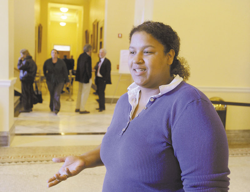 Samarali Daniels waits to speak at the State House in Augusta against cuts in health care.