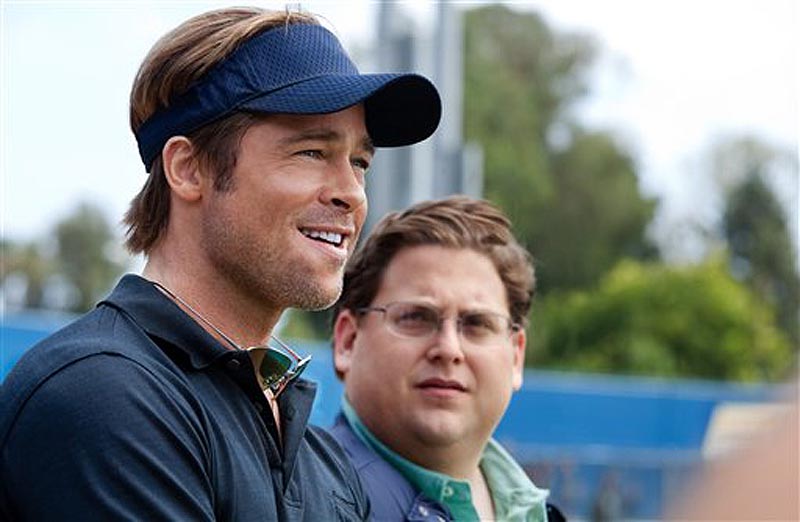 In this image released by Sony Pictures, Brad Pitt, left, and Jonah Hill are shown in a scene from "Moneyball." The film was nominated Thursday, Dec. 15, 2011, for a Golden Globe for best picture drama. Pitt was also nominated for best actor in a drama. The Golden Globes will be presented Jan. 15 at the Beverly Hilton Hotel, televised live by NBC and hosted by Ricky Gervais. (AP Photo/Columbia Pictures-Sony, Melinda Sue Gordon)