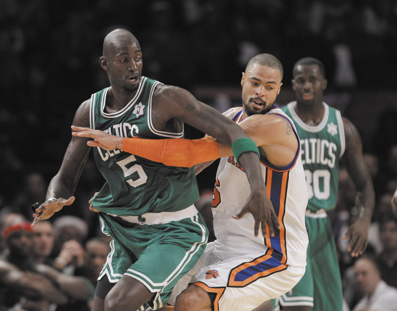 New York Knicks center Tyson Chandler (6) defends against Boston Celtics forward Kevin Garnett (5) in the first half Sunday at Madison Square Garden in New York on Sunday.
