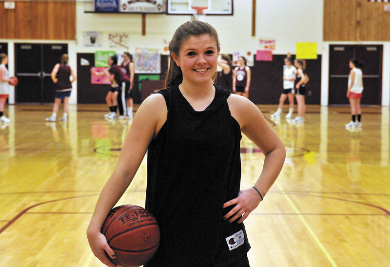 READY TO PLAY: Nokomis High School basketball player Megan Perry poses for a portrait before practice Wednesday in Newport.
