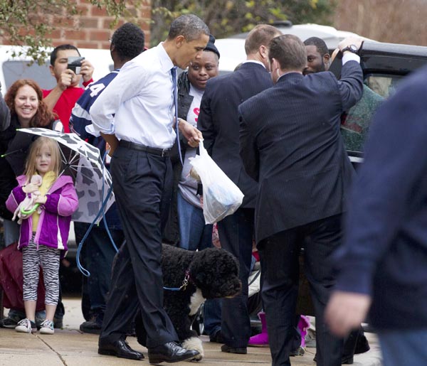 President Barack Obama and his dog Bo head for the motorcade after shopping at PetSmart today in Alexandria, Va.
