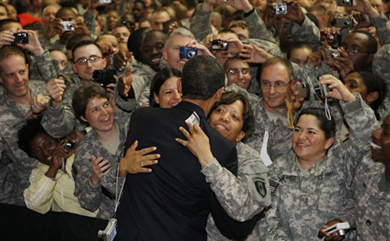 President Barack Obama hugs a soldier as he greets military personnel at Camp Victory in Baghdad, Iraq. On Friday, Dec. 2, 2011, the base that at its height was home to 46,000 people was handed over to the Iraqi government as America ended the war. (AP Photo/Charles Dharapak)