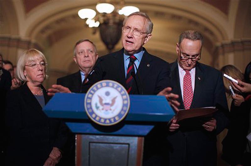 Senate Majority Leader Harry Reid of Nev., center, accompanied by, from left, Sen. Patty Murray, D-Wash., Senate Majority Whip Richard Durbin of Ill., and Sen. Charles Schumer, D-N.Y., speaks to reporters about extending the payroll tax cut, Thursday, Dec. 1, 2011, on Capitol Hill in Washington. (AP Photo/Charles Dharapak)
