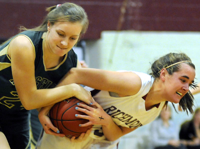 IT’S MINE: Richmond High School’s Jamie Plummer, right, pulls the ball away from Rangeley Lakes Regional High School’s Jenney Abbott during a game Tuesday in Richmond.