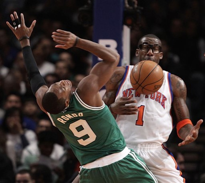 New York Knicks forward Amare Stoudemire (1) defends as Boston Celtics point guard Rajon Rondo (9) loses control of the ball in the second quarter of their NBA basketball game at Madison Square Garden in New York, Sunday, Dec. 25, 2011. (AP Photo/Kathy Willens) Amare Stoudemire, Rajon Rondo