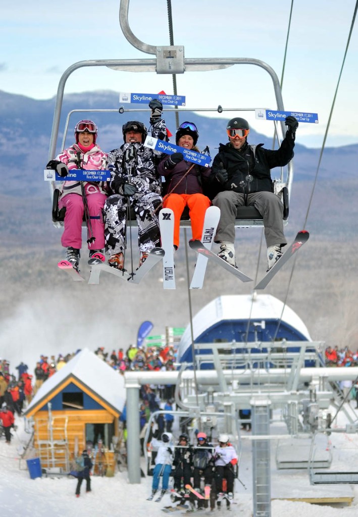 Staff photo by Michael G. Seamans From left to right, Meredith Strang Burgess, Doug Stewart, Chris Proulx and Chad Coleman, are the first skiers to ride the brand new Slyline lift at Sugarloaf Mountain Saturday morning. Saturday was the first day of operations for the rebuilt lift that was closed last season's lift accident.