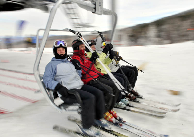 Staff photo by Michael G. Seamans Skiers load on to the Skyline lift at Sugarloaf Saturday morning.