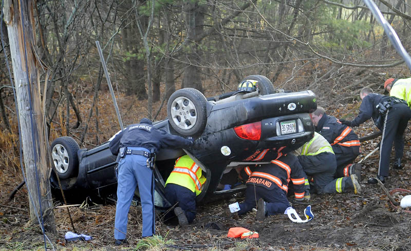 Police and firefighters free a woman trapped in a car that rolled over Monday morning on the Hallowell/Litchfield Road in West Gardiner. The vehicle left the road and snapped a utility pole around 8:30 a.m., according to Kennebec County Sheriff’s Deputy Aaron Moody, pinning the driver for more than 30 minutes. The driver was flown to a trauma center for evaluation, Moody said.