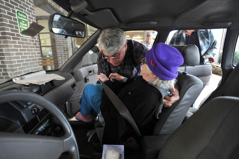 Staff photo by Michael G. Seamans Larry Barkow lifts his mother-in-law, Alice, into the car as they leave Franklin Memorial Hospital in Farmington after a routine bi-weekly check-up on November 15, 2011.