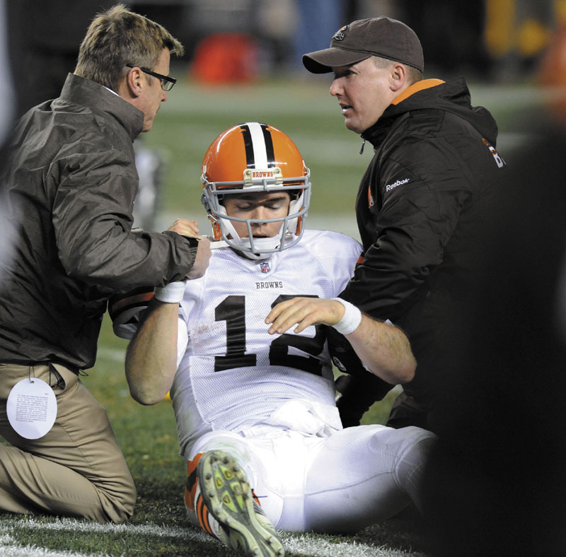 AP photo SCARY THOUGHTS: Cleveland Browns quarterback Colt McCoy is helped off the field after suffering a concussion earlier this season. In a series of interviews with The Associated Press, 23 of 44 NFL players said they would try to hide a brain injury rather than leave a game.