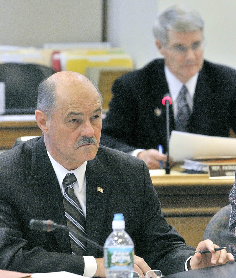 Health and Human Services committee co-chair Sen. Earle McCormick, R-West Gardiner, left, and Appropriations Committee co-chair Rep. Patrick Flood, R- Winthrop, listen to testimony on the second day of a public hearing on Gov. LePage's proposed Department of Health and Human Services budget cuts on Thursday afternoon at the State House in Augusta.