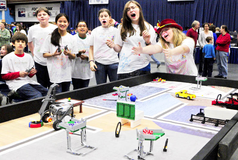 IT'S ROBOTIC: Messalonskee Middle School students Katelyn Naslund, far right, and Sarah Cormier, second from right, and the rest of the Infinite Fruit Loops react as their team's robot misses a task during the Maine First LEGO League Championship on Saturday at the Augusta Civic Center. About 500 students on 62 teams from across the state competed in the robotics contest.