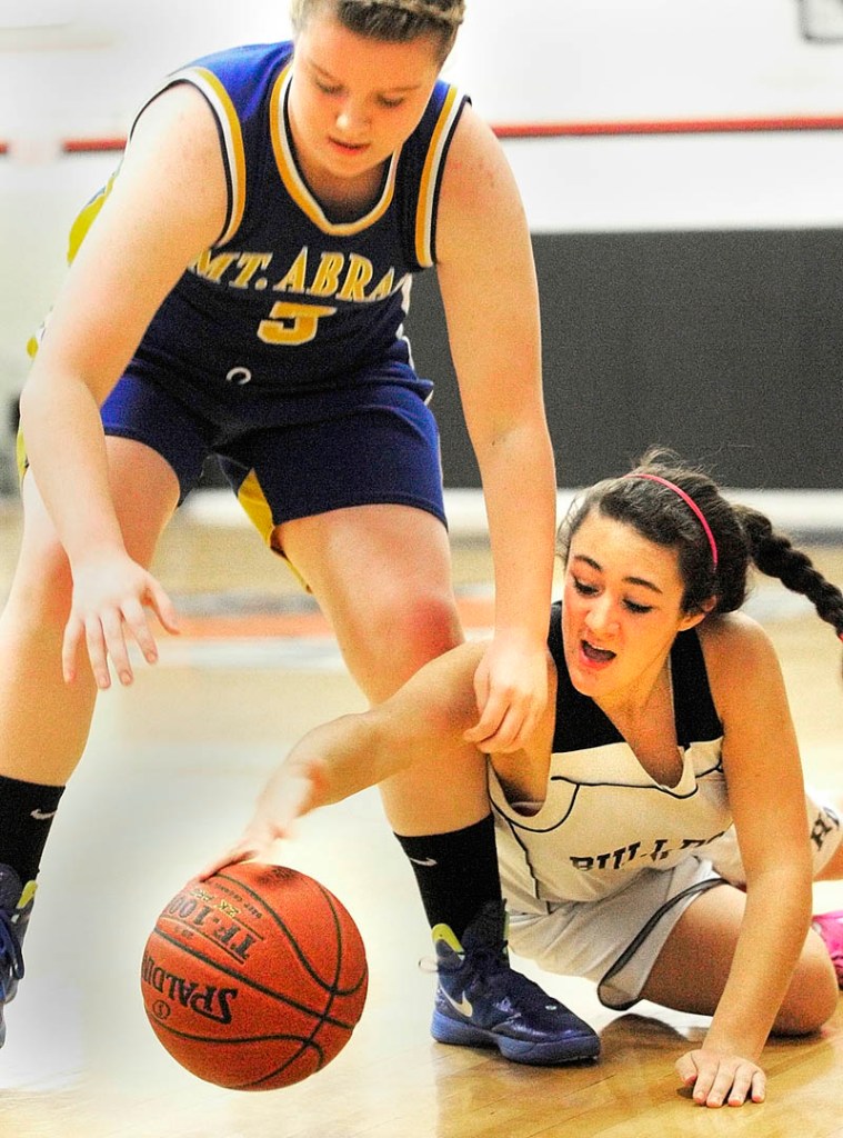 SCRAPPY PLAY: Mt. Abram’s Tori Lyn Beane, left, and Hall-Dale’s Wendy Goldman battle for a loose ball during a game Thursday night at Hall-Dale High School’s Penny Memorial Gymnasium in Farmingdale.