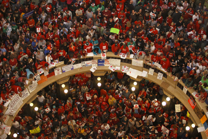 Protestors of Wisconsin Gov. Scott Walker s bill to eliminate collective bargaining rights for many state workers pack the rotunda at the State Capitol in Madison, Wis., Thursday, Feb. 17, 2011. "The Protestor" was named Time's "Person of the Year". (AP Photo/Andy Manis).