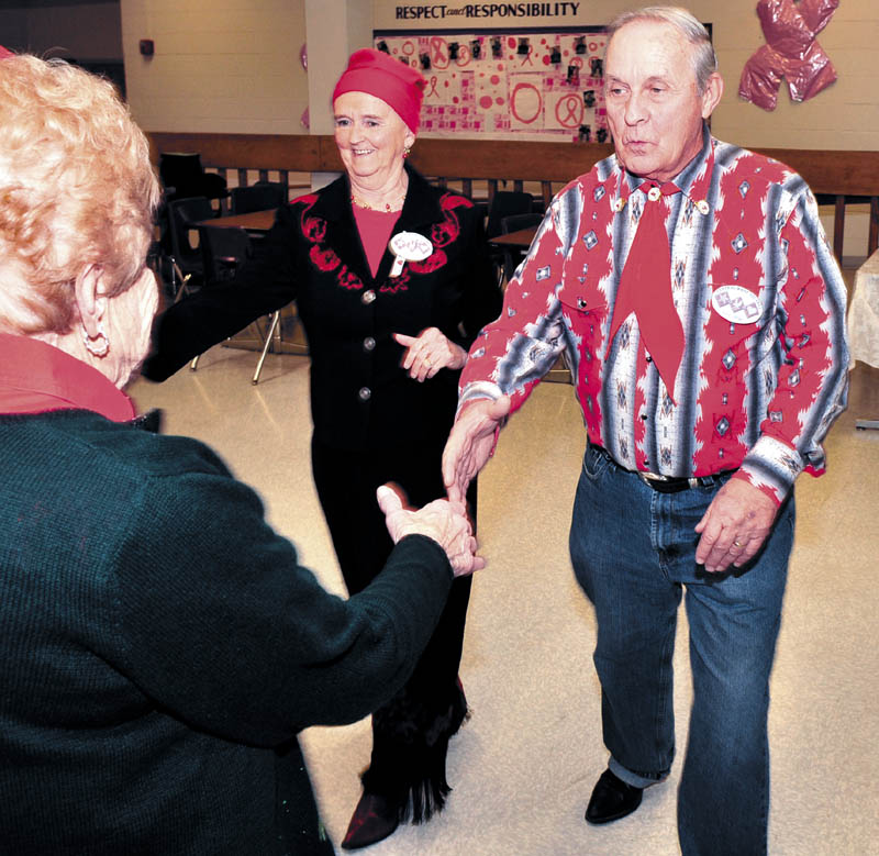 Carol and Eric Blier of Waterville dance with other area couples during a recent Central Maine Squares club sponsored square dance at the Waterville Junior High School.