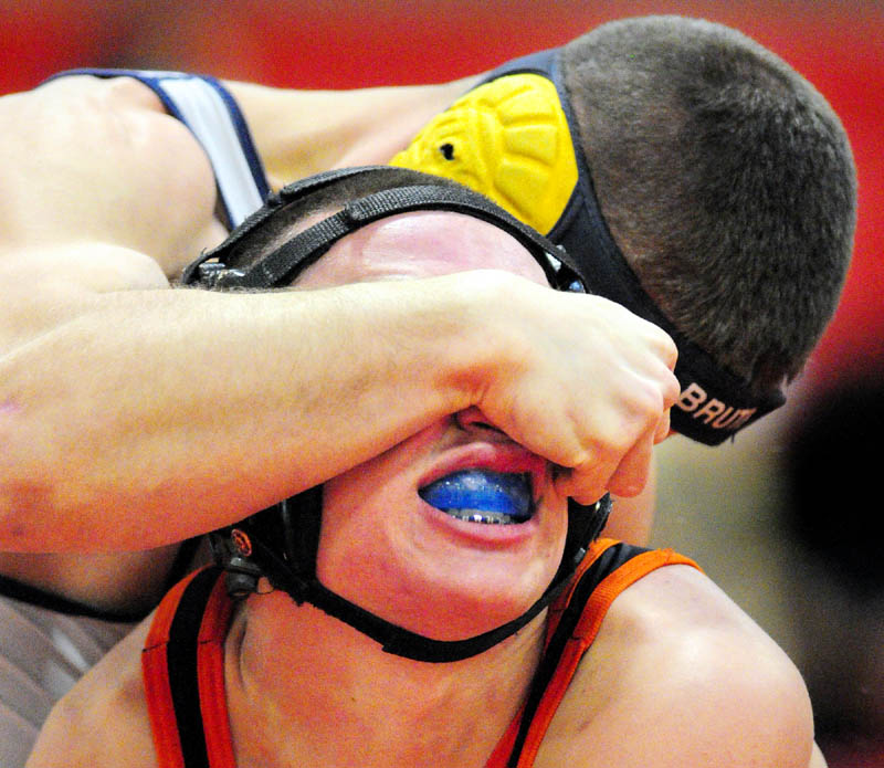 TOUGH SPOT: Mt. Blue’s Chris Ingram, top, grapples with Gardiner’s Wyatt Thornton in a 152-pound match during the Cony Duals on Tuesday at Cony High School in Augusta.