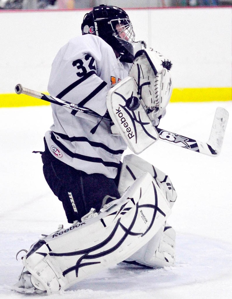 MHW Hawks goalie Tyler Plante deflects the puck during an intra-squad scrimmage on Wednesday at the Rist and Joy Bonnefond Ice Arena on the campus of Kents Hill School.