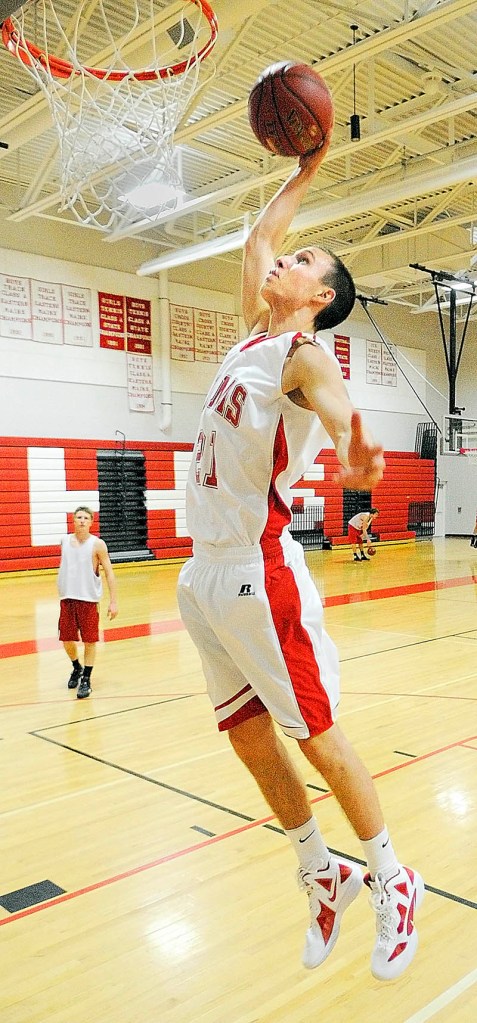 SLAM DUNK: Cony High School’s Walker Cooper shares his first name with his grandfather. His middle name is Pete, for three-peat, which his father Bruce as trying to accomplish with the Lawrence girls basketball the year Walker was born.