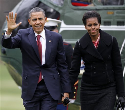 FILE - In this Dec. 14, 2011 file photo, President Barack Obama and first lady Michelle Obama arrive on the South Lawn of the White House in Washington. First lady Michelle Obama is a behind-the-scenes force in the White House whose opinions on policy and politics drew her into conflict with presidential advisers and who bristled at some of the demands and constraints of life as the president's wife, according to a detailed account of the first couple's relationship. (AP Photo/Haraz N. Ghanbari, File) FILE - In this Dec. 14, 2011 file photo, President Barack Obama and first lady Michelle Obama arrive on the South Lawn of the White House in Washington. First lady Michelle Obama is a behind-the-scenes force in the White House whose opinions on policy and politics drew her into conflict with presidential advisers and who bristled at some of the demands and constraints of life as the president's wife, according to a detailed account of the first couple's relationship. (AP Photo/Haraz N. Ghanbari, File)