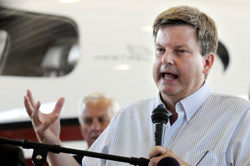 Kestrel Aircraft Co. CEO Alan Klapmeier speaks in front of a prototype six- to eight-passenger plane during an Augusta State Airport news conference in July 2010 to welcome the new company to Maine.