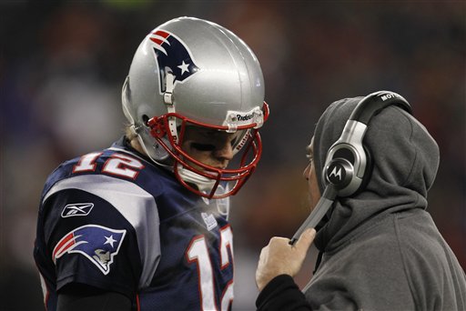 New England Patriots quarterback Tom Brady (12) talks to head coach Bill Belichick during the second half of an NFL divisional game against the Denver Broncos on Saturday in Foxborough, Mass. playoff playoffs