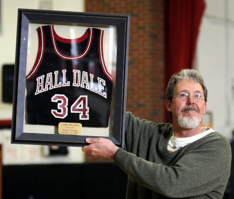 HONORED: Cam Brown holds his Hall-Dale High School basketball jersey Monday after it was retired at the Farmingdale school.