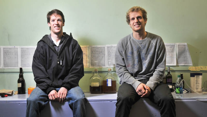 CIDER BUSINESS: Ben Manter, left, and Ross Brockman, 23, are co-founders of Downeast Cider House at the Hathaway Center in Waterville. The third co-founder, Tyler Mosher, is not pictured.