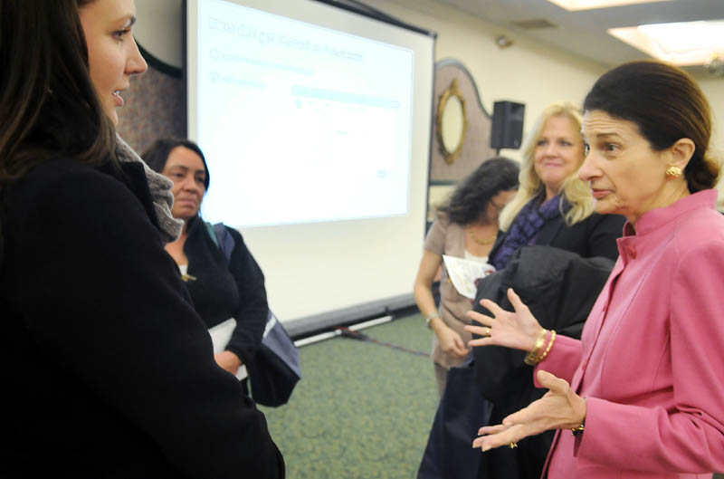ONLINE FORUM: U.S. Sen. Olympia Snowe, R-Maine, right, confers Tuesday with Laura Kibort, left, during an Augusta forum held by Facebook to assist small business to utilize the social networking site. Kibort is the event manager of the Royal Oak Room in Lewiston.