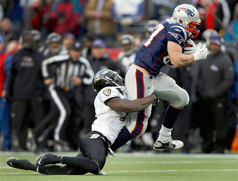 Baltimore Ravens strong safety Bernard Pollard (31) pulls down New England Patriots tight end Rob Gronkowski (87) after a pass reception during the first half of the AFC Championship NFL football game Sunday, Jan. 22, 2012, in Foxborough, Mass. (AP Photo/Charles Krupa) playoff playoffs